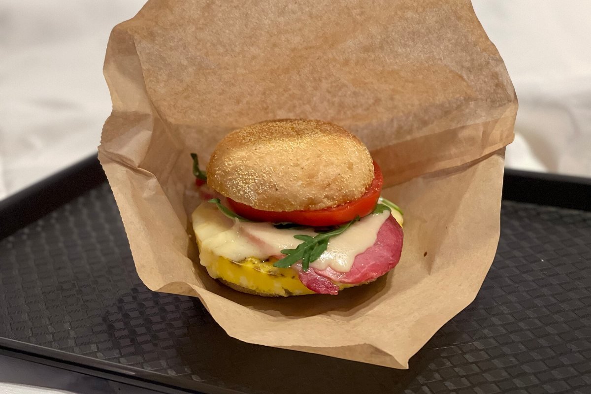 A breakfast sandwich on a plate.