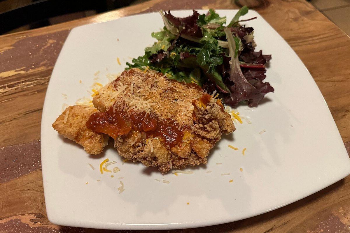 A plated chicken dinner.