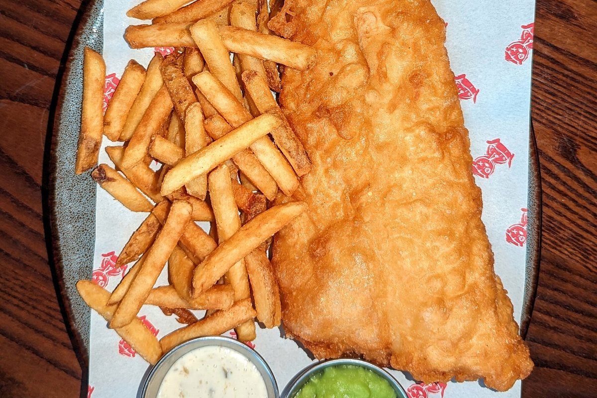 Fish and chips on a plate.